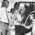 A male student opens a car door for a female student during a lesson on etiquette and social graces in 1972