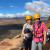 Two Year 9 students smiling while standing on a rocky ledge in the Flinders Ranges during Year 9 Camp