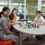 Three students playing chess at a lunchtime Chess Club
