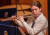 A member of the Flute Trio playing her flute at our Chamber Music Concert