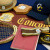 A collection of items from the Heritage Centre including an old tennis racquet, Concordia flag, straw hat, ribbon, modern cap and autograph book