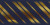 A fabric background reminiscent of the navy and gold Concordia tie pattern