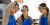 Three Senior School students look at a test tube containing dark blue liquid during a practical Science lesson