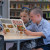 Two Primary School students reading a book written in German