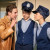 A cast member speaks to two fellow cast members dressed in police uniforms in a Year 11 Drama production