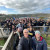 A large group of student musicians and Music teachers standing at a lookout on the Mount Gambier Music Tour