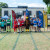 Primary School House Captains lined up on the finishing line of the running track with some of the Senior School House Captains