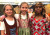 Three students in traditional cultural clothing as part of Harmony Week 2022