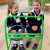 Two ELC students pretending to drive in the ELC garden