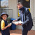 Paul Weinert distributing a pancake to a student on Shrove Tuesday