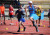 Two students running in a race at Sports Day