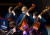 Three students playing double bass at Harmony in the Chapel