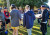 Students holding a tarpaulin as part of a group activity on Year 8 Camp