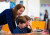 Bronwyn helping students