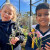 Two members of the sustainability group holding flowers during Morning Break club time