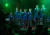 Our all-male Testosterphones choir singing under lights at our 2023 Vocal Cabaret concert