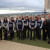 Year 12 Media students assembled for a group photo on a balcony with city views behind during an excursion to visit visual effects studios and digital media training institutions