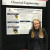 Rebecca Tan standing in front of a display board relating to Chemical Engineering