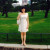 Alina Bi standing in front of a park